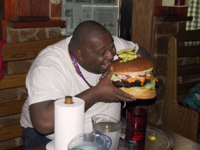 dude-eating-huge-hamburger